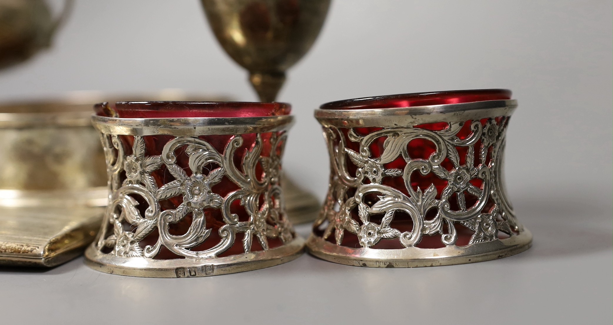 Sundry small silver including a modern wine coaster, a pair of Irish pierced silver salts(a.f.), two goblets, two small trophy cups and a cigarette case.